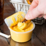 Muy Fresco 3.8 oz. Microwavable Cheddar Cheese Sauce Cup - 30/Case - Image 3