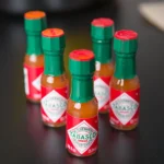 125 fl. oz. Original Hot Sauce Mini Bottles - 144/Case - Image 3